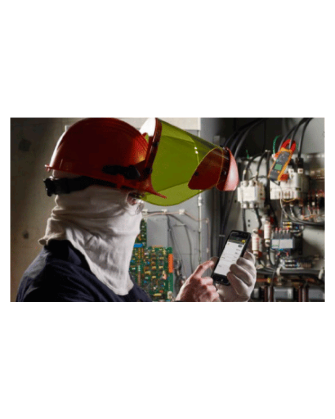 Industrial worker using Fluke 378 FC clamp meterfor electrical testin g