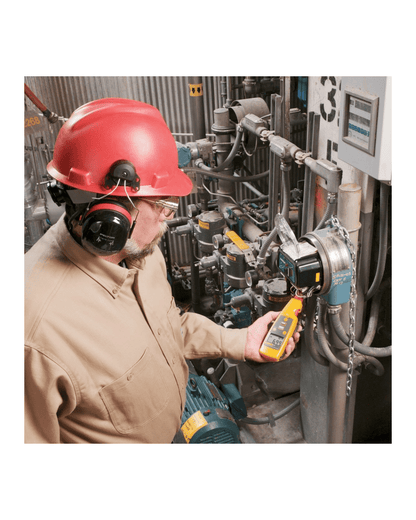 Fluke 771 process clamp meter testing on machinery in a factory setting